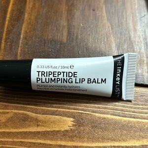 The Inky list triple peptide, plumping lip balm in the shade pink